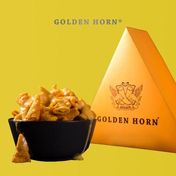 Golden Horn Snack & Dip product photo with our triangular box and a bowl of snacks